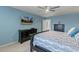 Spacious main bedroom with carpet and a TV mounted on the wall at 244 W Copenhaver Dr, Clayton, NC 27527
