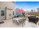 Cozy patio with table, chairs, and umbrella, perfect for outdoor dining and relaxation at 244 W Copenhaver Dr, Clayton, NC 27527