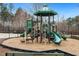 Community playground with slides, climbing structures, and a soft landing surface for safety at 244 W Copenhaver Dr, Clayton, NC 27527