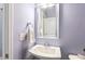 Traditional powder room with a pedestal sink and a bright, decorative mirror at 244 W Copenhaver Dr, Clayton, NC 27527