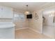 Bright dining area with wood floors, window, and decorative light fixture at 2850 North Carolina 561, Louisburg, NC 27549