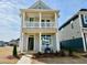 Charming two-story home featuring a covered porch, balcony, and stylish architectural details in a newly developed neighborhood at 30 Nimble Way # 171, Clayton, NC 27520