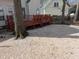 View of backyard with a stone-covered ground and a dark wood deck with railings at 3109 Benton Cir, Raleigh, NC 27615