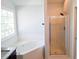 Serene bathroom featuring a soaking tub and a separate shower for a spa-like experience at 3109 Benton Cir, Raleigh, NC 27615
