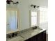 Elegant bathroom featuring dual sinks, granite countertops, and modern fixtures at 3109 Benton Cir, Raleigh, NC 27615