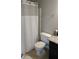 Bathroom featuring a shower with curtain and modern toilet at 3109 Benton Cir, Raleigh, NC 27615