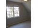 Neutral bedroom featuring a ceiling fan and a large window with natural light at 3109 Benton Cir, Raleigh, NC 27615