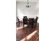 Dining room with hardwood flooring and a chandelier above a wooden table and chairs at 3109 Benton Cir, Raleigh, NC 27615