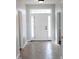 Bright foyer with decorative glass details above the front door and tile flooring at 3109 Benton Cir, Raleigh, NC 27615
