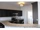 Modern kitchen featuring granite countertops, stainless steel appliances, and a breakfast bar at 3109 Benton Cir, Raleigh, NC 27615