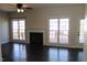 Bright living room with dark floors, a fireplace, and access to an outdoor deck at 3109 Benton Cir, Raleigh, NC 27615