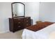 Well-appointed bedroom with a dark dresser, offering ample storage space and a restful retreat at 3109 Benton Cir, Raleigh, NC 27615