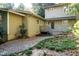 Backyard view with brick and wood exterior, and a wood deck and gravel yard at 3601 Swann St, Raleigh, NC 27612