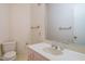 Cozy powder room features wallpaper, single vanity, and toilet at 3601 Swann St, Raleigh, NC 27612