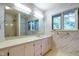 This spacious bathroom includes a large vanity, ample counter space, a window, and a shower at 3601 Swann St, Raleigh, NC 27612
