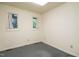 Bright bedroom with carpet flooring and two windows at 3601 Swann St, Raleigh, NC 27612