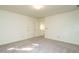 This bedroom is spacious with neutral carpet, two closets, and an open entryway into another room at 3601 Swann St, Raleigh, NC 27612