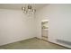 Inviting dining room featuring a modern chandelier and an open view into the kitchen at 3601 Swann St, Raleigh, NC 27612