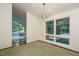 Elegant dining room with stylish chandelier and large windows providing ample natural light at 3601 Swann St, Raleigh, NC 27612
