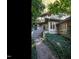 Home exterior featuring a stone walkway surrounded by lush greenery, leading to the front entrance at 3601 Swann St, Raleigh, NC 27612