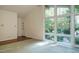 Bright living room featuring large windows, hardwood floors, and a welcoming atmosphere at 3601 Swann St, Raleigh, NC 27612