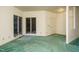 Spacious living room with carpet flooring and windows showcasing the natural surroundings at 3601 Swann St, Raleigh, NC 27612
