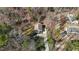 Aerial view of a home with a large, wooded lot offering privacy and a long driveway at 3741 Manly Farm Rd, Wake Forest, NC 27587