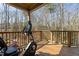 Relaxing back porch with exercise bike and wooded view at 3741 Manly Farm Rd, Wake Forest, NC 27587