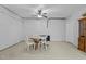 Unfinished basement area with carpet, table and chairs, and exposed cinder block wall at 3741 Manly Farm Rd, Wake Forest, NC 27587