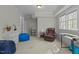 Finished basement area with neutral walls, plush carpet, and recreational furniture at 3741 Manly Farm Rd, Wake Forest, NC 27587