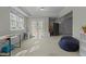 Spacious room with white trim, carpet, and a door to the backyard at 3741 Manly Farm Rd, Wake Forest, NC 27587