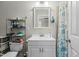 Bathroom with white cabinets, decorative mirror, and shower at 3741 Manly Farm Rd, Wake Forest, NC 27587