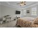 Spacious bedroom featuring a TV, desk, and two windows for natural light at 3741 Manly Farm Rd, Wake Forest, NC 27587