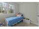 Bright bedroom featuring a twin bed and a large window at 3741 Manly Farm Rd, Wake Forest, NC 27587