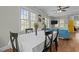 Open-concept dining room features natural light, hardwood floors, and is adjoined to the living room at 3741 Manly Farm Rd, Wake Forest, NC 27587