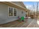 Home exterior with gray siding, white trim, and a deck with dining set at 3741 Manly Farm Rd, Wake Forest, NC 27587