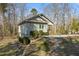 Charming gray home featuring a well-maintained lawn and surrounded by beautiful mature trees at 3741 Manly Farm Rd, Wake Forest, NC 27587
