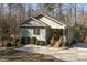 Charming home with a welcoming front porch and bright yellow door at 3741 Manly Farm Rd, Wake Forest, NC 27587