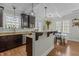 Modern kitchen with stainless steel appliances, granite countertops, is open to the dining area at 3741 Manly Farm Rd, Wake Forest, NC 27587