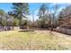 The backyard has a storage shed, fence, and mature trees at 40 Golden Timber Cir, Four Oaks, NC 27524