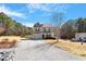 Beautiful two-story home with neutral siding, and gravel driveway at 40 Golden Timber Cir, Four Oaks, NC 27524