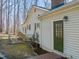 Exterior view of home with green door leading to backyard at 405 Lookout Pt, Rougemont, NC 27572