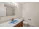 Simple bathroom with a blue sink, shower, and neutral color scheme at 405 Lookout Pt, Rougemont, NC 27572