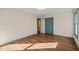 Bedroom with beautiful hardwood floors and closet with blue trim at 405 Lookout Pt, Rougemont, NC 27572