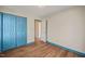 Bedroom featuring blue trim and hardwood floors at 405 Lookout Pt, Rougemont, NC 27572