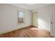 Bedroom with hardwood floors, a window, and a closet perfect for storage at 405 Lookout Pt, Rougemont, NC 27572
