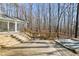 Wooden deck with multiple levels creates a spacious outdoor living area, perfect for enjoying the surrounding trees at 405 Lookout Pt, Rougemont, NC 27572