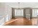 The dining room has hardwood floors and a big window that lets in lots of natural light at 405 Lookout Pt, Rougemont, NC 27572