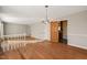Dining room featuring hardwood floors, chandelier, and views into the kitchen at 405 Lookout Pt, Rougemont, NC 27572