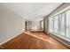 Bright living room featuring hardwood floors and large window allowing lots of natural sunlight in at 405 Lookout Pt, Rougemont, NC 27572